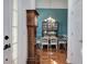 View from foyer into dining room boasting chandelier, hardwood floors, and elegant furnishings at 192 Adelaide Xing, Acworth, GA 30101