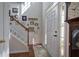 Inviting foyer with staircase and hardwood flooring, showcasing natural light and decorative accents at 192 Adelaide Xing, Acworth, GA 30101