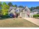 Charming two-story home with a well-manicured lawn and two-car garage at 192 Adelaide Xing, Acworth, GA 30101