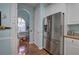 Kitchen featuring stainless steel appliances, white cabinets, and hardwood floors at 192 Adelaide Xing, Acworth, GA 30101