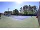 Well-maintained community tennis courts surrounded by lush trees at 192 Adelaide Xing, Acworth, GA 30101