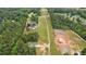 Expansive aerial view showcasing the property and surrounding wooded area at 220 Rocky Point Rd, Covington, GA 30014