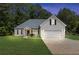 Charming single-Gathering home featuring a well-manicured lawn, attached two car garage, and traditional design at 220 Rocky Point Rd, Covington, GA 30014
