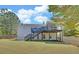Expansive backyard showcasing a deck with stairs and screened porch, perfect for outdoor enjoyment at 2800 Araglin Dr, Dacula, GA 30019