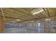 Bright unfinished basement with studded walls, electrical, and ceiling insulation at 2800 Araglin Dr, Dacula, GA 30019