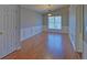 The dining room features wainscoting and hardwood floors at 2800 Araglin Dr, Dacula, GA 30019