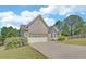 Charming brick home with a two-car garage and well-manicured lawn and landscaping at 2800 Araglin Dr, Dacula, GA 30019