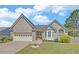 Charming single-Gathering home features a well-maintained lawn, attached two-car garage, and classic brick facade at 2800 Araglin Dr, Dacula, GA 30019