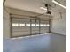 Open garage with a large white door and overhead lighting at 2800 Araglin Dr, Dacula, GA 30019