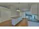 Kitchen featuring an island, white cabinets, and modern appliances at 2800 Araglin Dr, Dacula, GA 30019