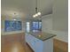 Open kitchen with an island, recessed lighting, and hardwood floors at 2800 Araglin Dr, Dacula, GA 30019