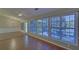 This room features hardwood flooring and three large windows at 2800 Araglin Dr, Dacula, GA 30019