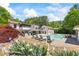 A beautiful backyard offers a pool, lounge chairs, and colorful landscaping at 345 Etheridge Rd, Auburn, GA 30011