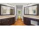 Bathroom with double vanities, providing ample space and storage, and view to bedroom at 345 Etheridge Rd, Auburn, GA 30011