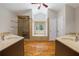 Bathroom featuring double vanities, soaking tub, and glass shower at 345 Etheridge Rd, Auburn, GA 30011