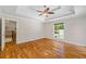 Bright bedroom with hardwood floors, tray ceiling, and natural light at 345 Etheridge Rd, Auburn, GA 30011