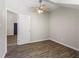An empty bedroom features a fan, hard floors, and natural light at 345 Etheridge Rd, Auburn, GA 30011
