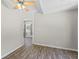 An empty bedroom features a fan, hard floors, and natural light at 345 Etheridge Rd, Auburn, GA 30011