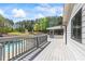 A large deck has views of the pool, yard and wooded area at 345 Etheridge Rd, Auburn, GA 30011