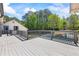 A large outdoor deck overlooks the backyard and pool, perfect for entertaining and enjoying the outdoors at 345 Etheridge Rd, Auburn, GA 30011