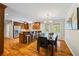 Open kitchen and dining area featuring hardwood floors, stainless steel appliances, and a breakfast bar at 345 Etheridge Rd, Auburn, GA 30011