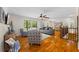 Spacious living room showcasing wood floors, stylish furniture, and large windows that provide scenic views at 345 Etheridge Rd, Auburn, GA 30011