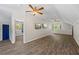 Open living room with wood floors, recessed lighting, and two ceiling fans at 345 Etheridge Rd, Auburn, GA 30011