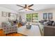 Bright living room with large windows, stylish furnishings, and hardwood floors at 345 Etheridge Rd, Auburn, GA 30011