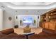 Inviting living room with built-in shelves, home entertainment system, and comfortable leather seating at 345 Etheridge Rd, Auburn, GA 30011