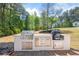 Outdoor kitchen with stainless steel grill, granite countertops, and ample storage space at 345 Etheridge Rd, Auburn, GA 30011