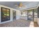 Charming screened patio featuring tile flooring, ceiling fan and an abundance of natural light at 345 Etheridge Rd, Auburn, GA 30011