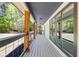 A covered front porch with wood columns and railings provides a welcoming entrance to the home at 345 Etheridge Rd, Auburn, GA 30011
