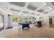 Bright recreation room with tile flooring, game table, and access to the outdoor pool at 345 Etheridge Rd, Auburn, GA 30011