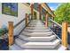 Stairs lead to the front door of this home with a decorative railing at 345 Etheridge Rd, Auburn, GA 30011