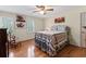 Bright bedroom with hardwood floors, complemented by natural light and traditional decor at 3521 Jefferson Township Pkwy, Marietta, GA 30066