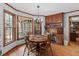 Dining area with a wood table and natural light, complemented by traditional wood trim and design at 3521 Jefferson Township Pkwy, Marietta, GA 30066