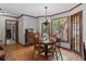 Cozy dining room features hardwood floors, wood trim, and natural light from the bay window at 3521 Jefferson Township Pkwy, Marietta, GA 30066