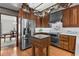 A view of the kitchen showcasing stainless steel appliances, wood cabinetry and butcher block at 3521 Jefferson Township Pkwy, Marietta, GA 30066