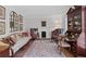 Formal living room with hardwood floors, fireplace and built-in shelving at 3521 Jefferson Township Pkwy, Marietta, GA 30066