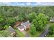 Stunning aerial view of brick home nestled in a lush, green neighborhood at 4213 Schooner Ne Ct, Roswell, GA 30075