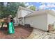 Home's backyard featuring playground and stone pathway with modern siding at 4213 Schooner Ne Ct, Roswell, GA 30075