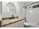 Clean bathroom featuring granite countertop vanity, subway tile shower, and updated fixtures at 4213 Schooner Ne Ct, Roswell, GA 30075