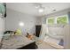 Cozy bedroom with abundant natural light and ceiling fan at 4213 Schooner Ne Ct, Roswell, GA 30075