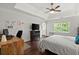 Bedroom features hardwood floors, a tray ceiling, and lots of natural light at 4213 Schooner Ne Ct, Roswell, GA 30075