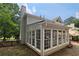 Exterior view of a home featuring a sunroom with multiple windows at 4213 Schooner Ne Ct, Roswell, GA 30075