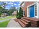 Inviting front entrance with brick steps and a vibrant blue door at 4213 Schooner Ne Ct, Roswell, GA 30075