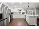 Modern kitchen featuring white cabinets, stainless steel appliances, and a center island at 4213 Schooner Ne Ct, Roswell, GA 30075