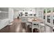 Kitchen and breakfast nook features white cabinets, stainless appliances, and eat-in table at 4213 Schooner Ne Ct, Roswell, GA 30075