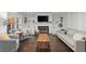 Inviting living room features a fireplace, built-in shelving, and hardwood floors at 4213 Schooner Ne Ct, Roswell, GA 30075