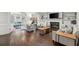Cozy living room featuring a fireplace, built-in shelving, and hardwood floors at 4213 Schooner Ne Ct, Roswell, GA 30075